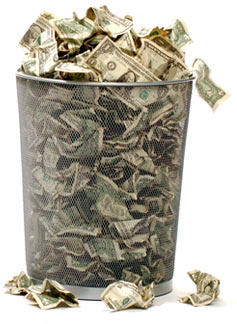Trash can filled with money.