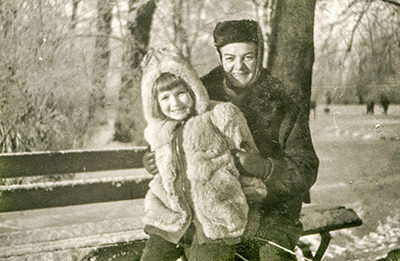 The same vintage photo with the crease retouched out.