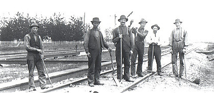 Group of railroad workers stopping to pose for a picture.