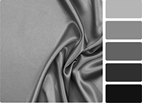 A gray satin sheet with color swatches on the side