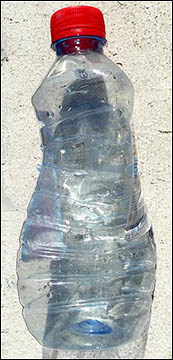 Air pressure crushing a plastic bottle