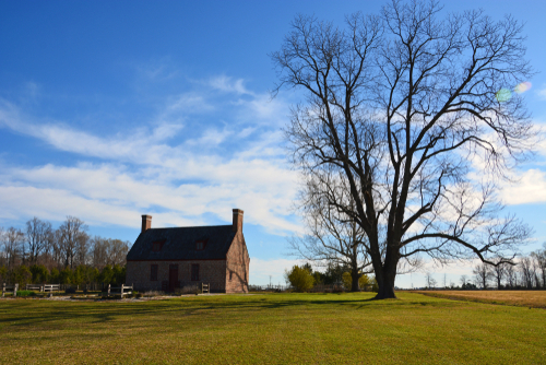 A small 18th Century colonial era brick farmhouse located on the east coast of the United States.