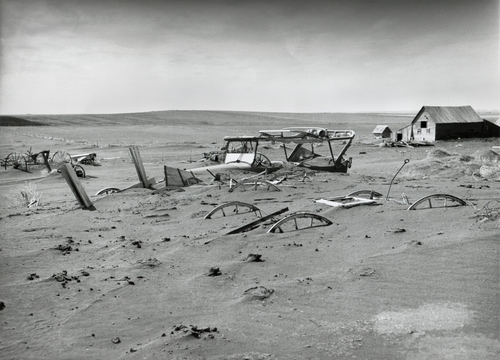Buried machinery in a barn lot in Dallas, South Dakota in 1936.