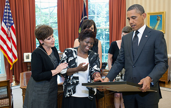 an original plaintiff from the Olmstead decision, Lois Curtis, meets with the President
