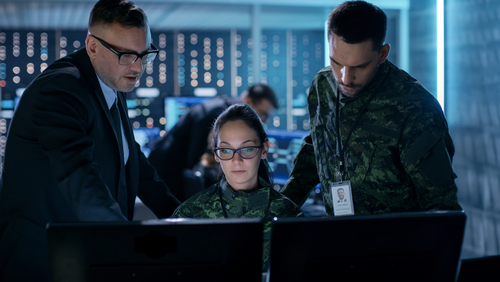 Government Surveillance Agency and Military Joint Operation. Male Agent, Female and Male Military Officers Working at System Control Center.