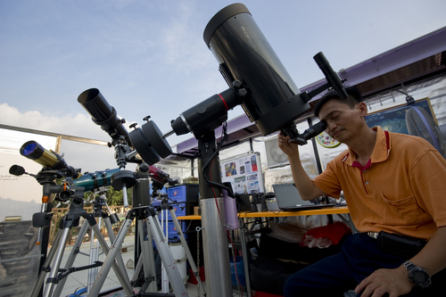 Amature astronomer doing own research about sun at Observatory