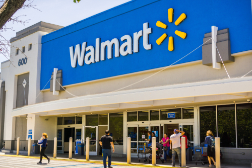 People going in and coming out of a Walmart store on a sunny day, south San Francisco bay area.