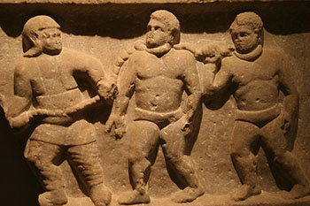 Roman collared slaves. Marble relief