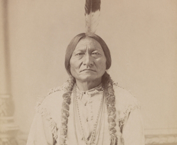 Chief Sitting Bull holding peace pipe in 1885 photo
