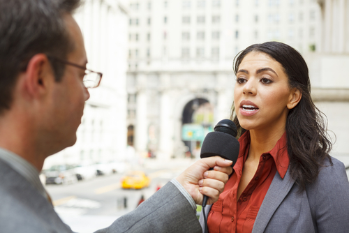 Reporter interviewing someone