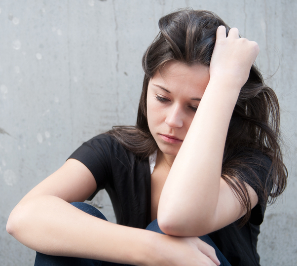 Worried girl sitting down