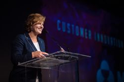 Melanie Cook accepts award