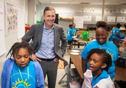 GEA CEO Kevin Nolan with JCPS Backpack League