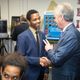 Louisville Mayor Greg Fischer greets student leader Ghadi Nshimiyimani at the launch of the Doss High School mock assembly line