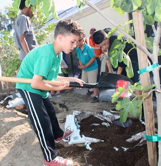 Children Celebrate Arbor Day by Planting Trees