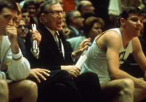 Coach Wooden on the bench