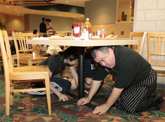 People participating in an earthquake safety drill