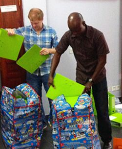 Preparing education packets for African poor