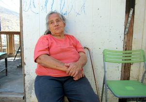 Woman sits outside Tijuana clinic