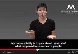 UCLA student Joanna Fan signs museum guide