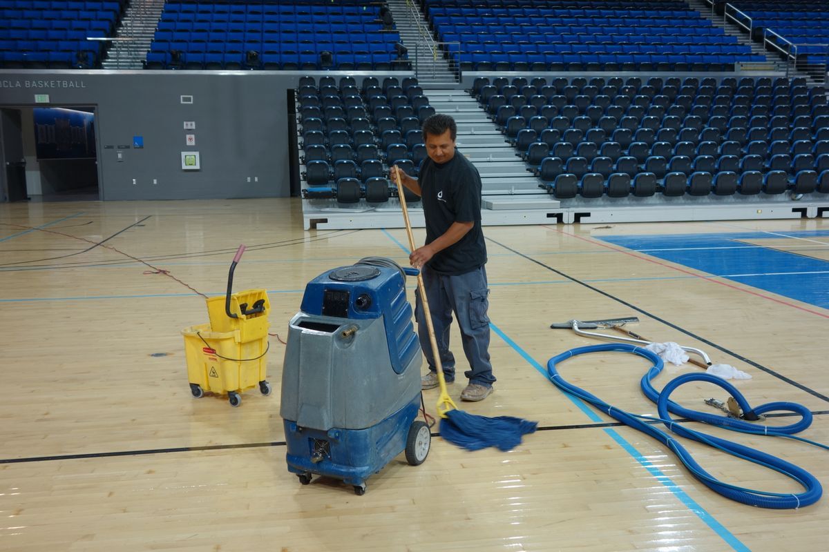 Mopping Pauley Pavilion court
