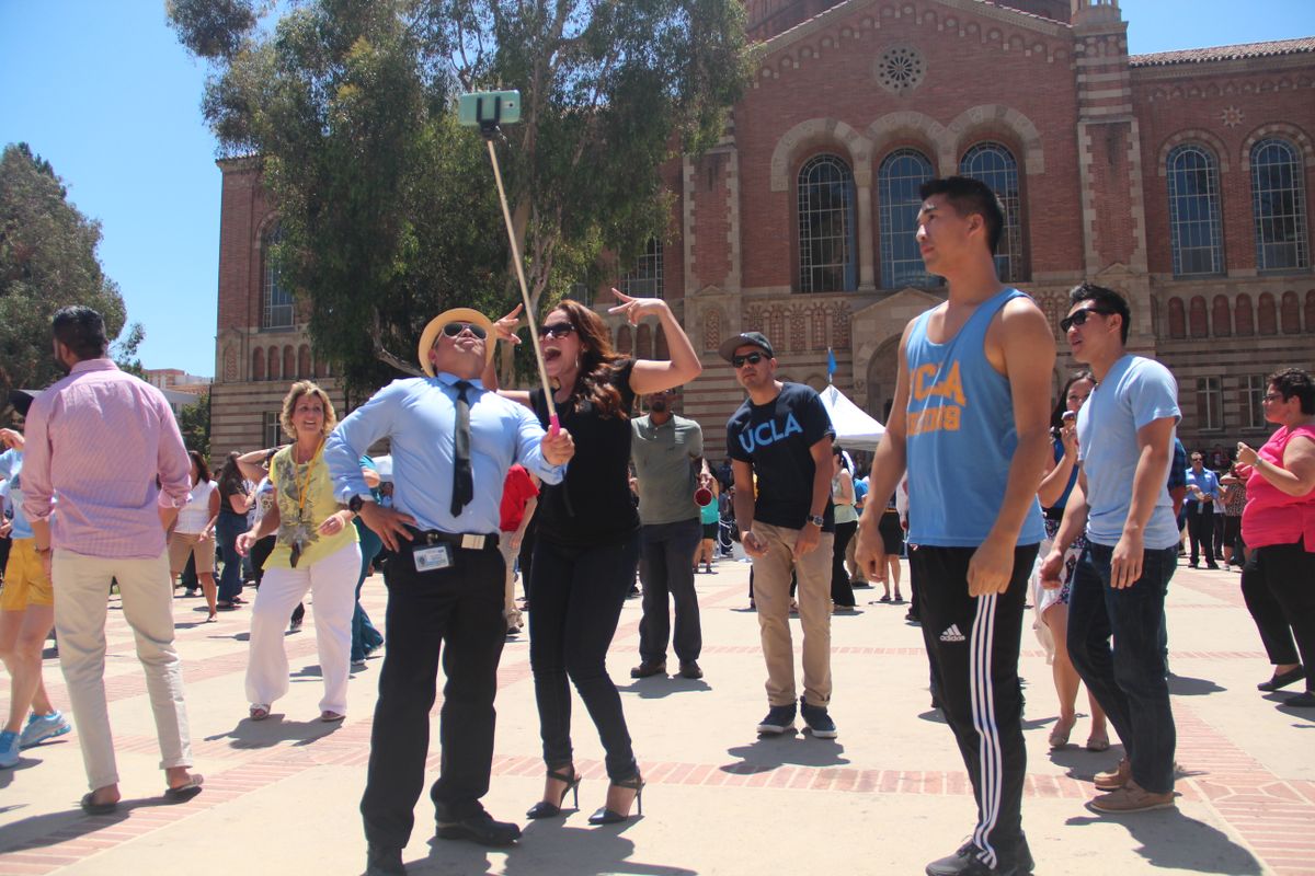Staff picnic selfie dancing