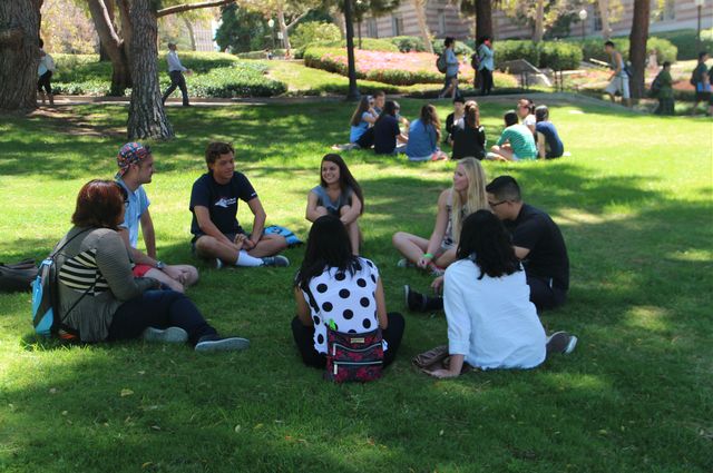 Incoming freshmen gather in small groups after a presentation on sexual violence and other issues to share ideas and opinions and to ask questions.