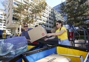 Mother and daughter unload their car.