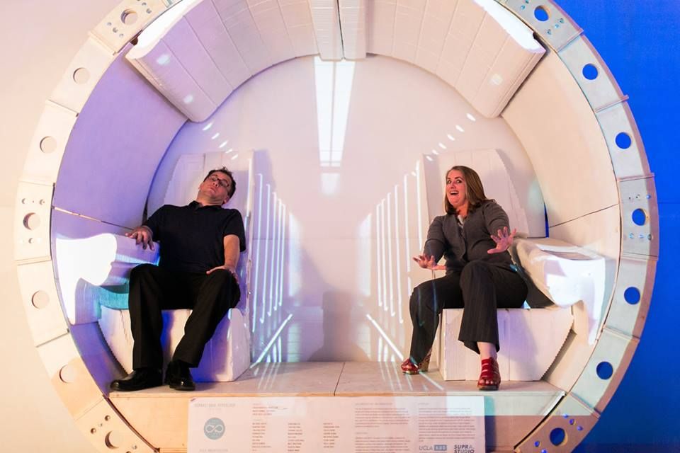 Two attendees in prototype of the Hyperloop