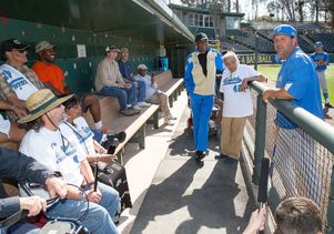 Head baseball coach John Savage talks to veterans