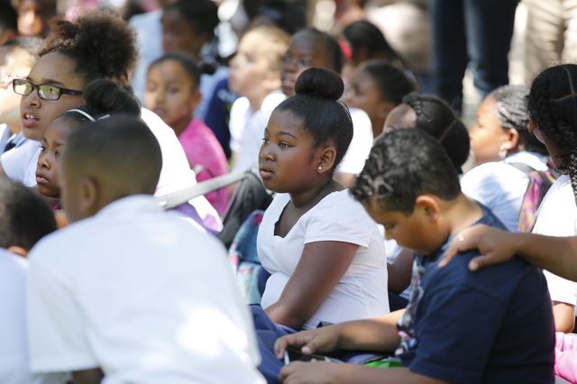 Students listen to a rebroadcast of Dr. Martin Luther King Jr.'s speech