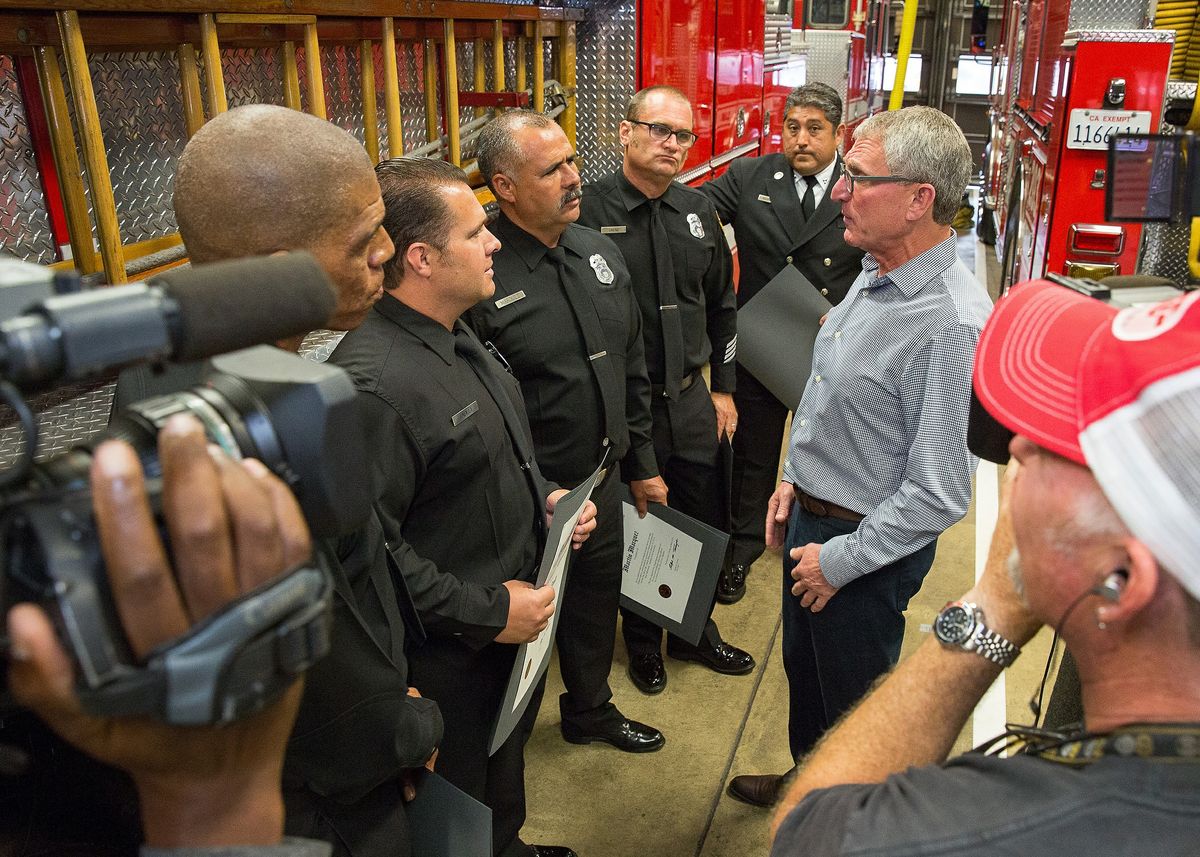 Charles Gold talks to his rescuers