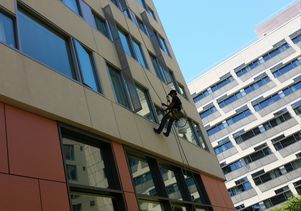 Window washer working at a dorm on the Hill