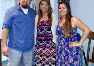 Julie Hancock (center) and her children, Daniel and Shannon