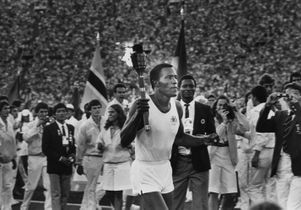 Rafer Johnson carries 1984 Olympics torch