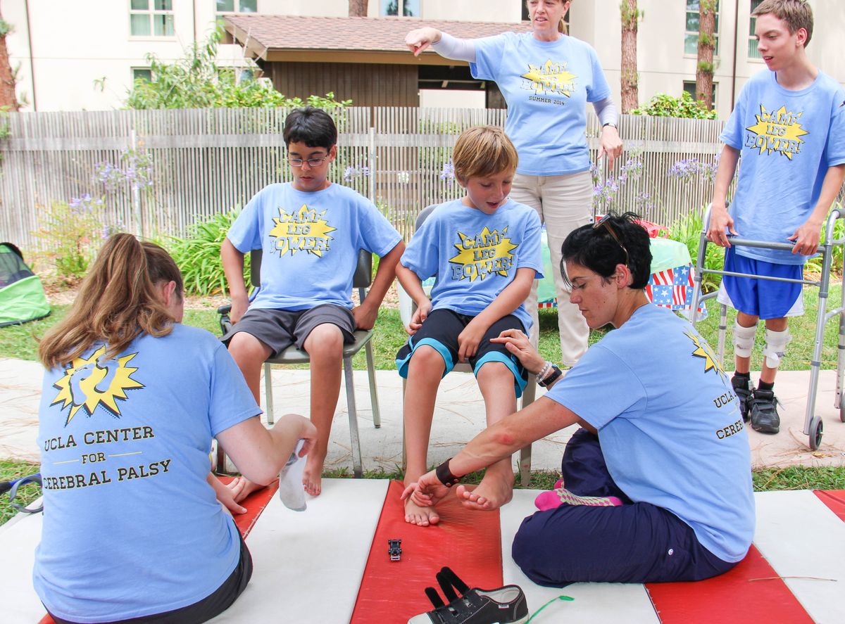 Student volunteers and campers at Camp Leg Power