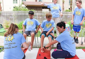 Student volunteers and campers at Camp Leg Power
