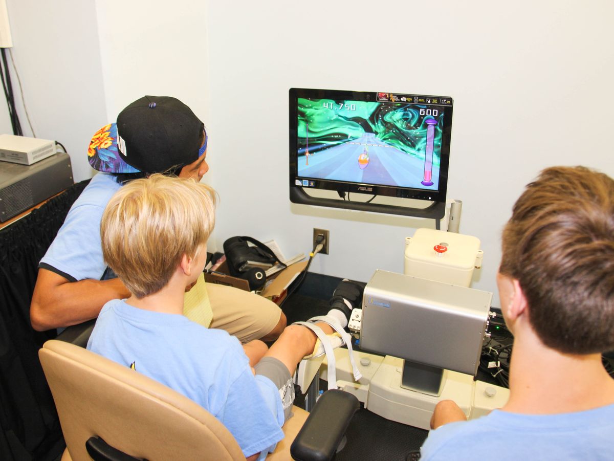 Oliver Mann, camper Niko Corzo and volunteer Ky Soriano