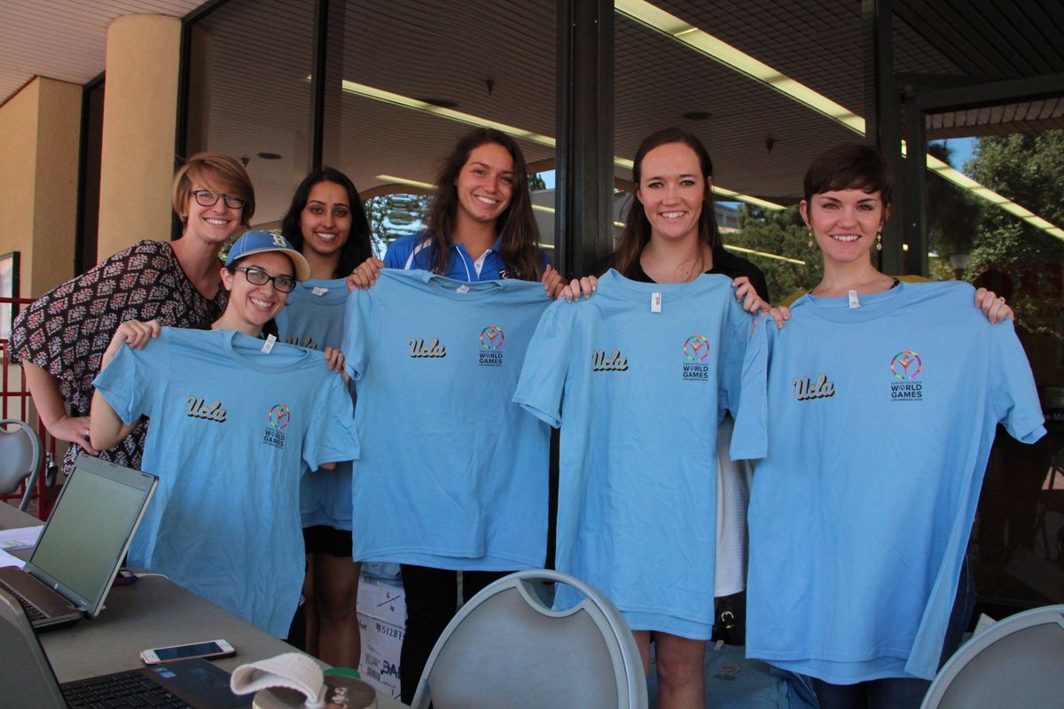 UCLA Volunteer Center and UCLA Recreation show off t-shirts for volunteers