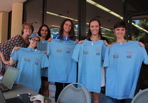 UCLA Volunteer Center and UCLA Recreation show off t-shirts for volunteers