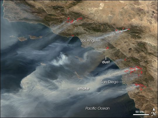 Santa Ana winds push wildfires