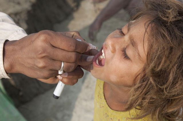 Child in Bihar, India, gets polio vaccine.