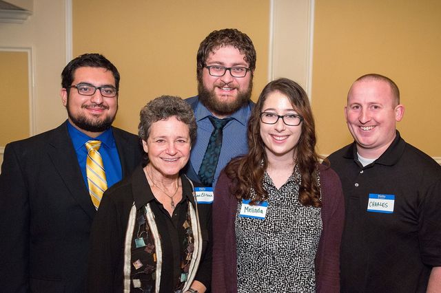 Andrew and Jorge Sincuir with three blood donors who helped save Jorge's life