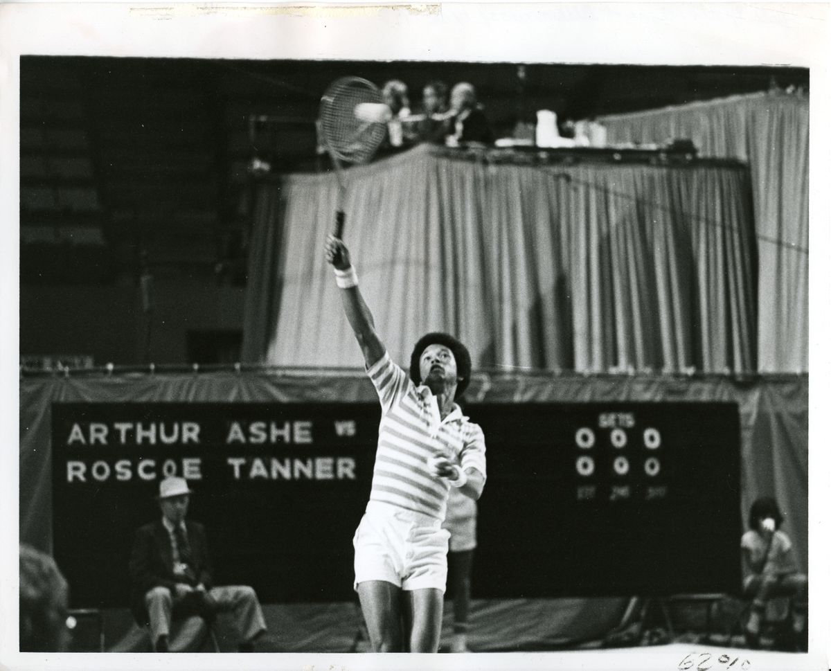 Arthur Ashe playing tennis in Pauley Pavilion
