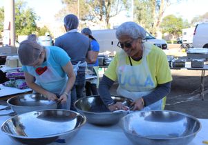 Volunteers work at the Westside Thanksgiving Community Dinner and Celebration