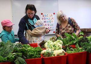 Graduate student families select produce at UCLA University Village