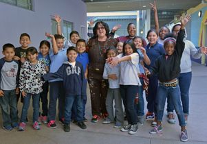 Judy Baca and students
