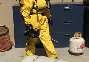 Trainee in a course for safe hazardous waste handling