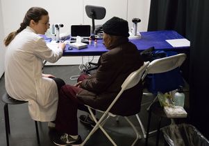 Dr. Laura Ann Vickers and a patient