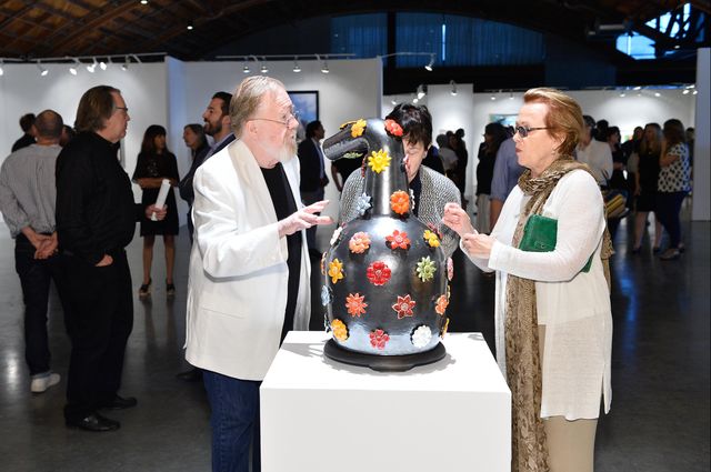 Adrian Saxe and visitors to the UCLA Benefit Exhibition and Art Sale